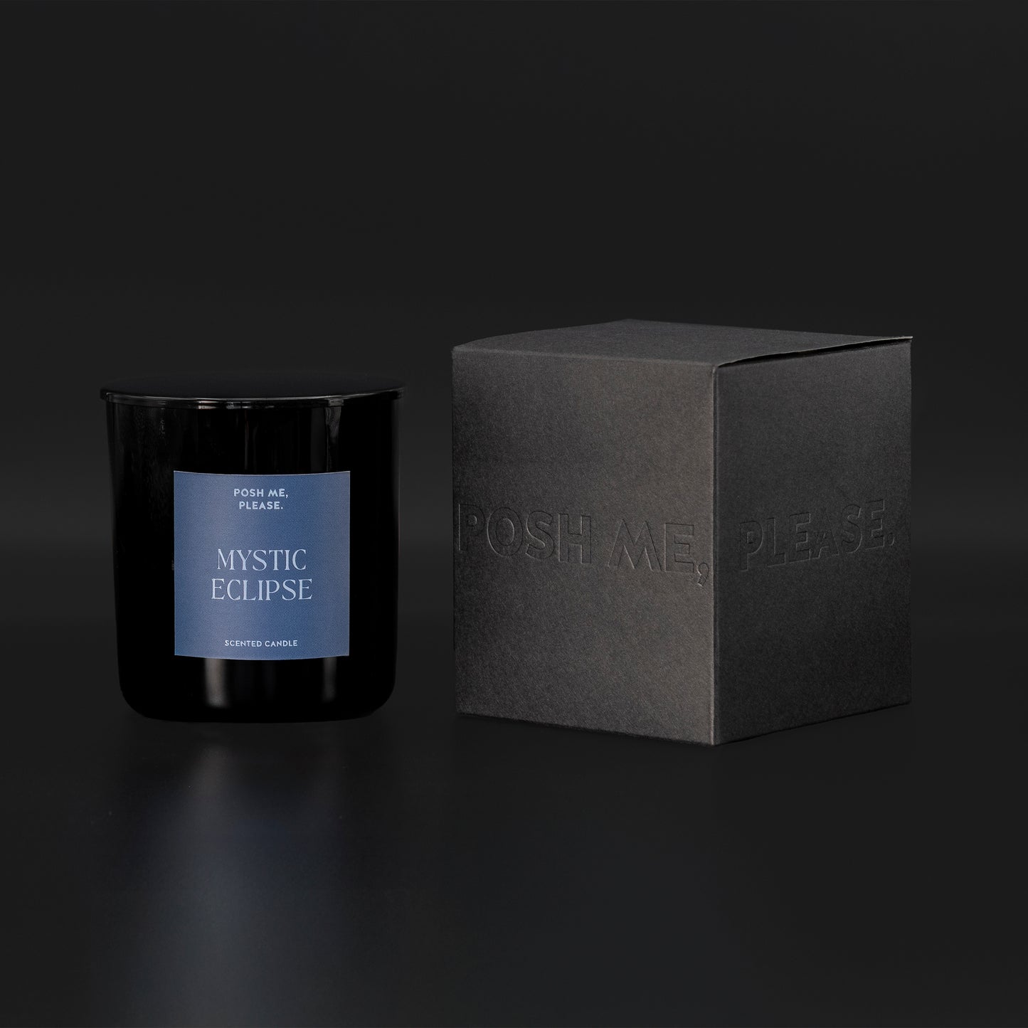 Mystic Eclipse candle beside black embossed POSH ME, PLEASE. gift box, dark background