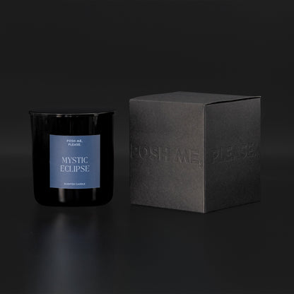Mystic Eclipse candle beside black embossed POSH ME, PLEASE. gift box, dark background