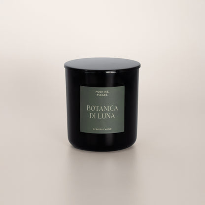 Botanica di Luna black glass candle with green label by POSH ME, PLEASE., lid on, light background