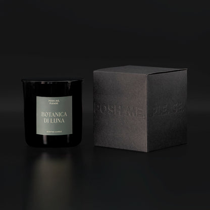Botanica di Luna candle beside black embossed POSH ME, PLEASE. gift box, dark background