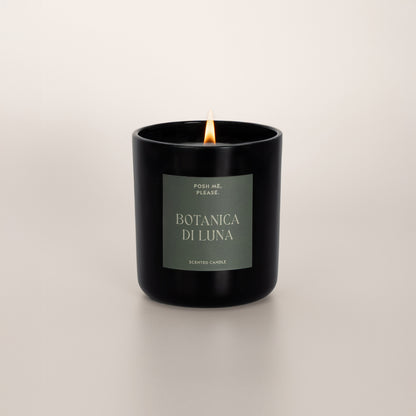 Lit Botanica di Luna candle with flame, clean coconut wax burn, neutral background