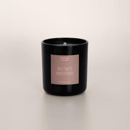 Do Not Disturb coconut wax candle in black glass vessel, no lid, cotton wick visible