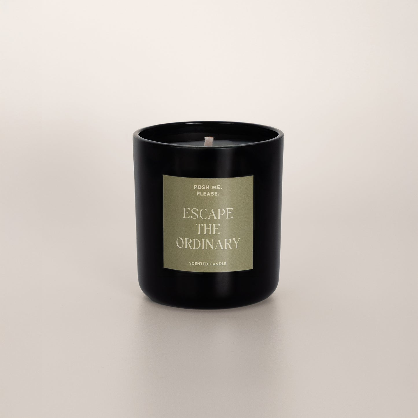 Escape the Ordinary coconut wax candle in black glass vessel, no lid, cotton wick
visible