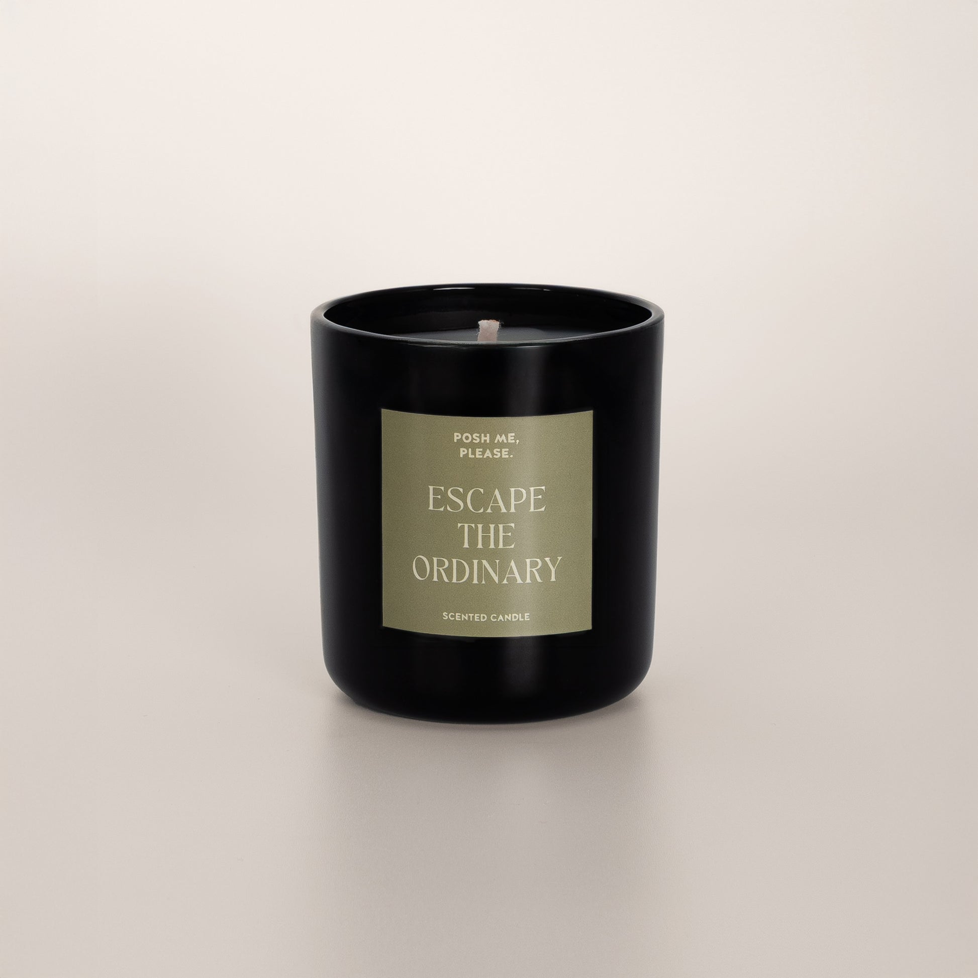 Escape the Ordinary coconut wax candle in black glass vessel, no lid, cotton wick
visible