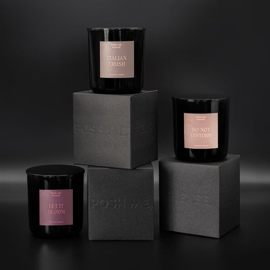 Italian Crush, Do Not Disturb and Let It Bloom candles stacked on embossed POSH ME, PLEASE. black blocks, dark background