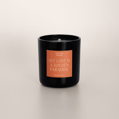 Get Lost in a Golden Paradise coconut wax candle in black glass vessel, no lid, cotton wick visible
