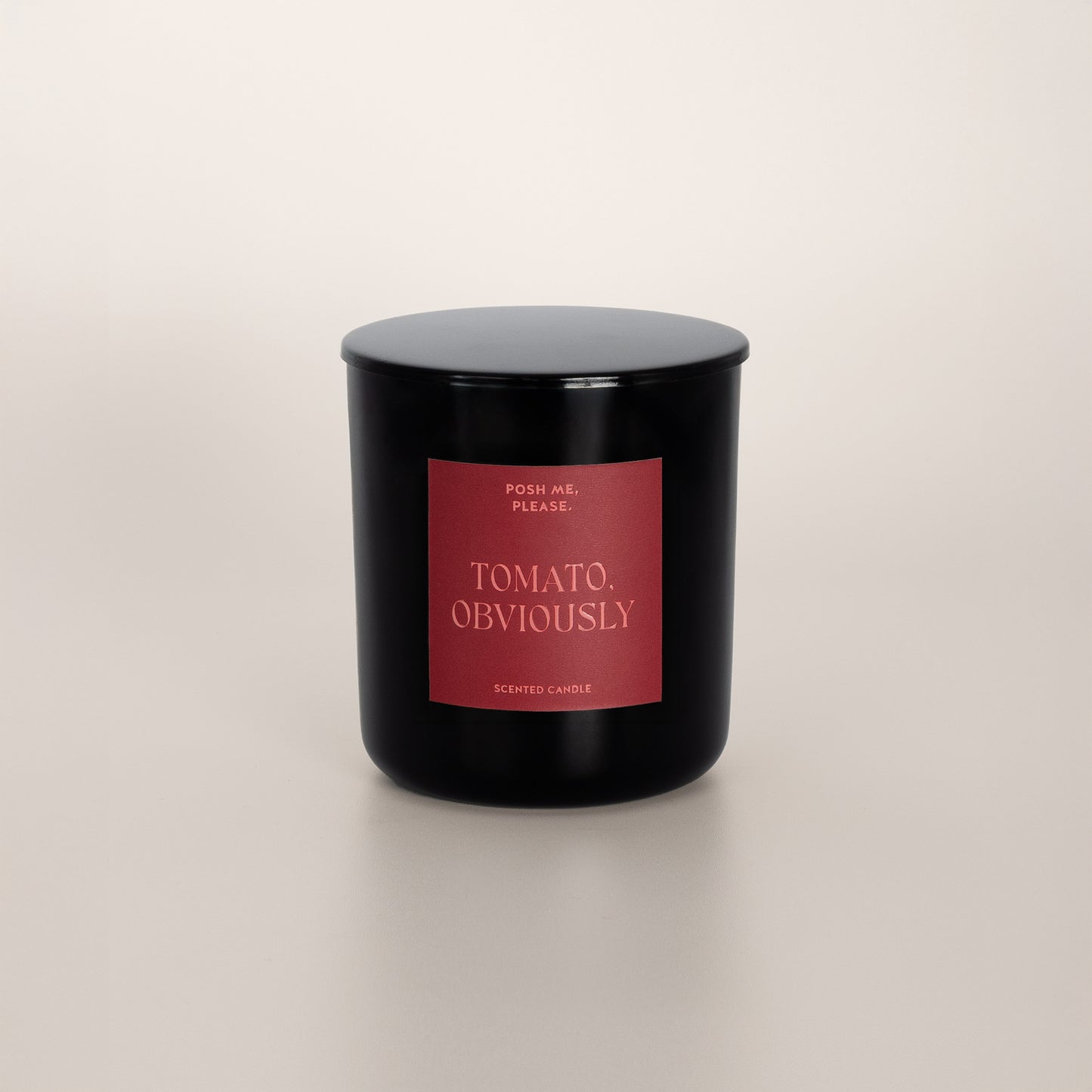 Tomato, Obviously black glass candle with deep red label by POSH ME, PLEASE.,
lid on, light background
