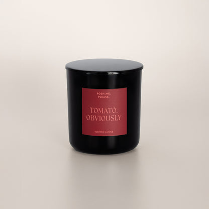 Tomato, Obviously black glass candle with deep red label by POSH ME, PLEASE.,
lid on, light background