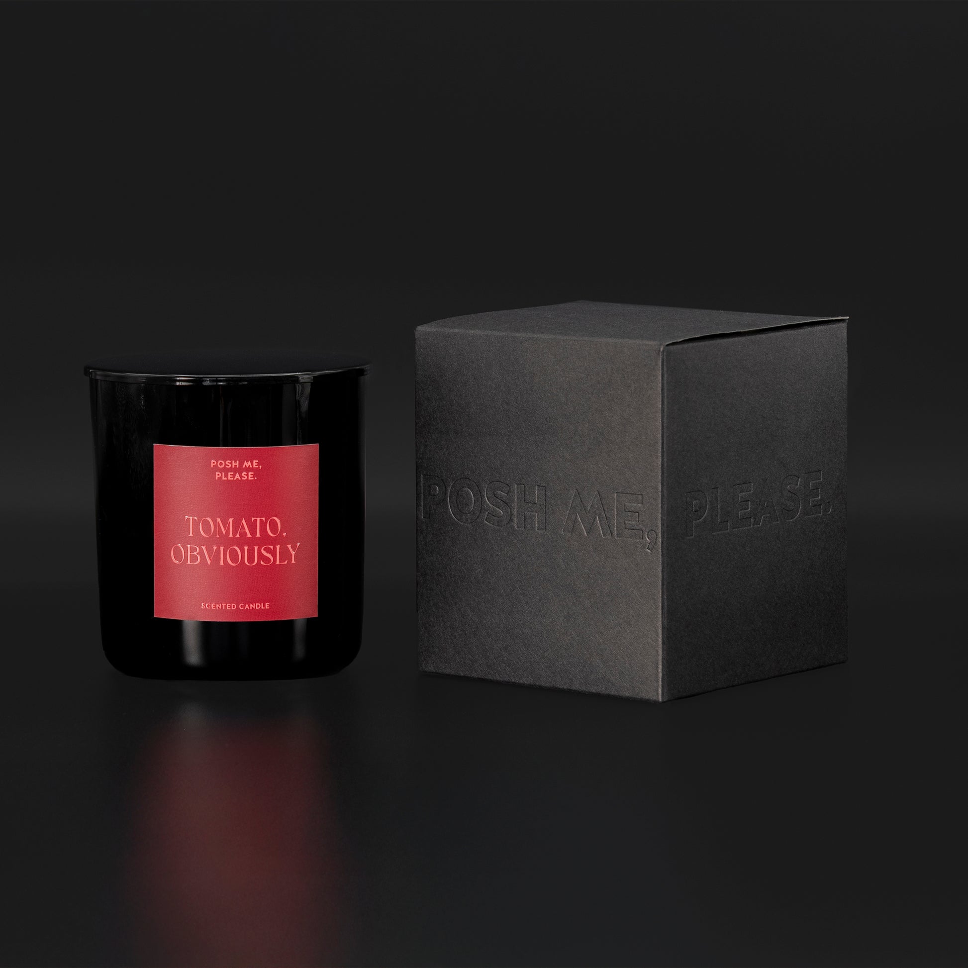 Tomato, Obviously candle beside black embossed POSH ME, PLEASE. gift box,
dark background