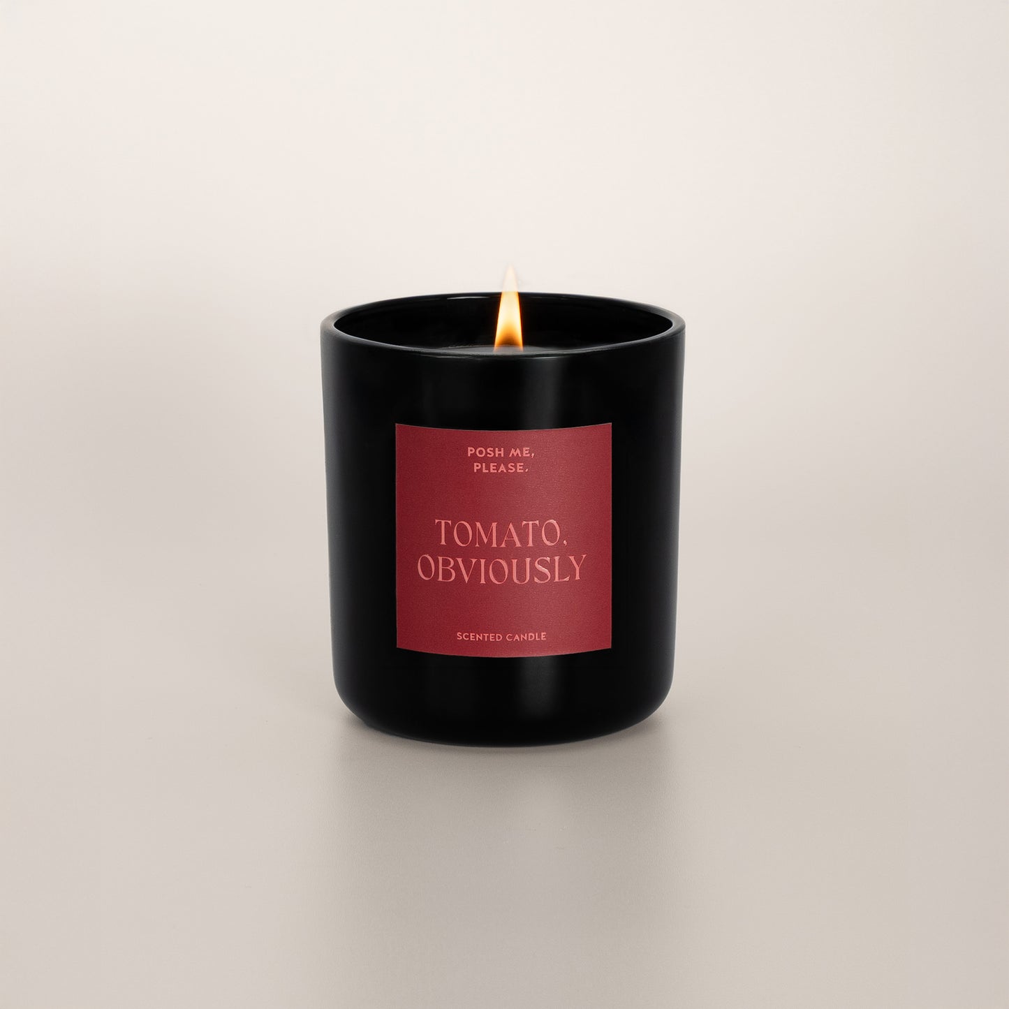 Lit Tomato, Obviously candle with flame, tomato leaf scent, neutral background