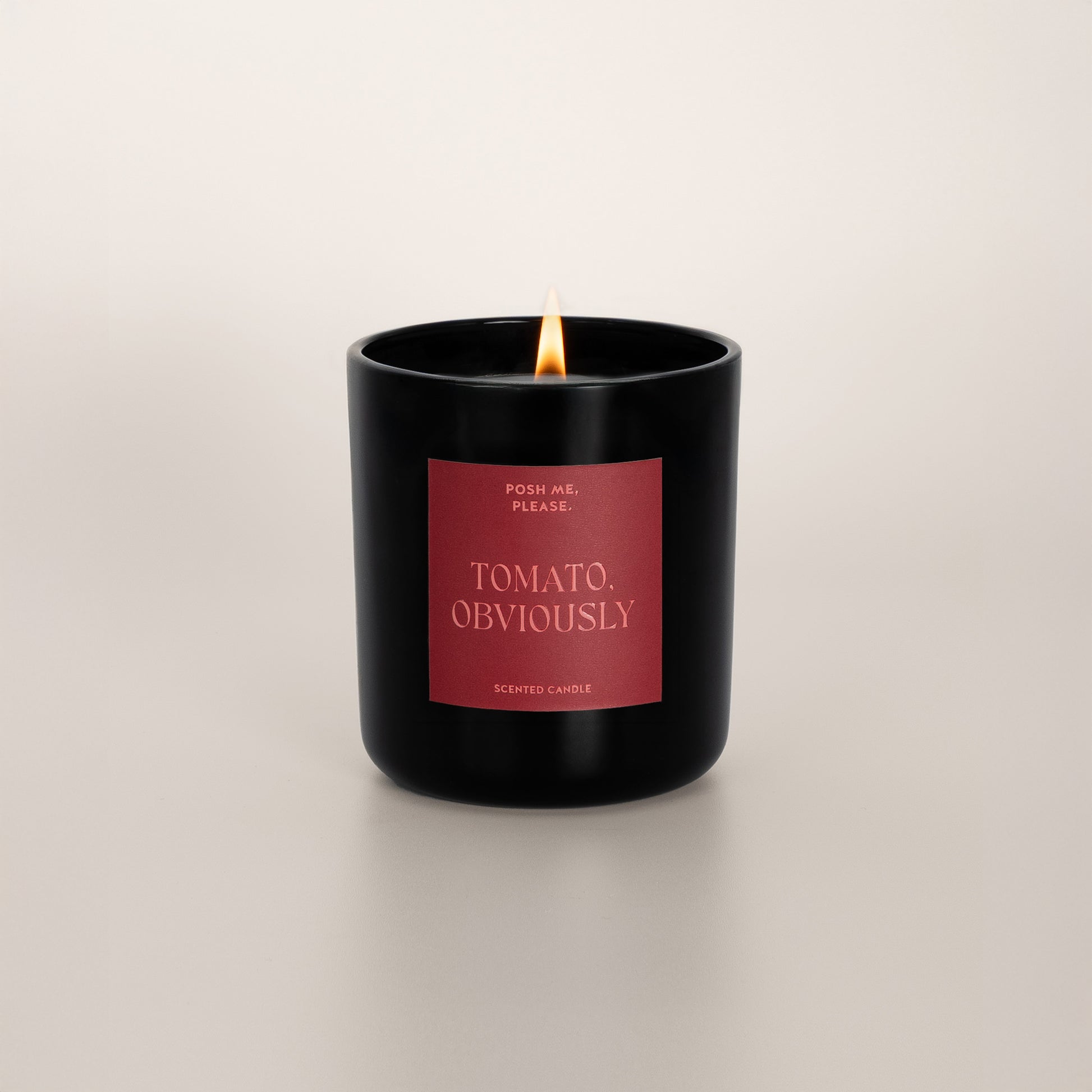 Lit Tomato, Obviously candle with flame, tomato leaf scent, neutral background