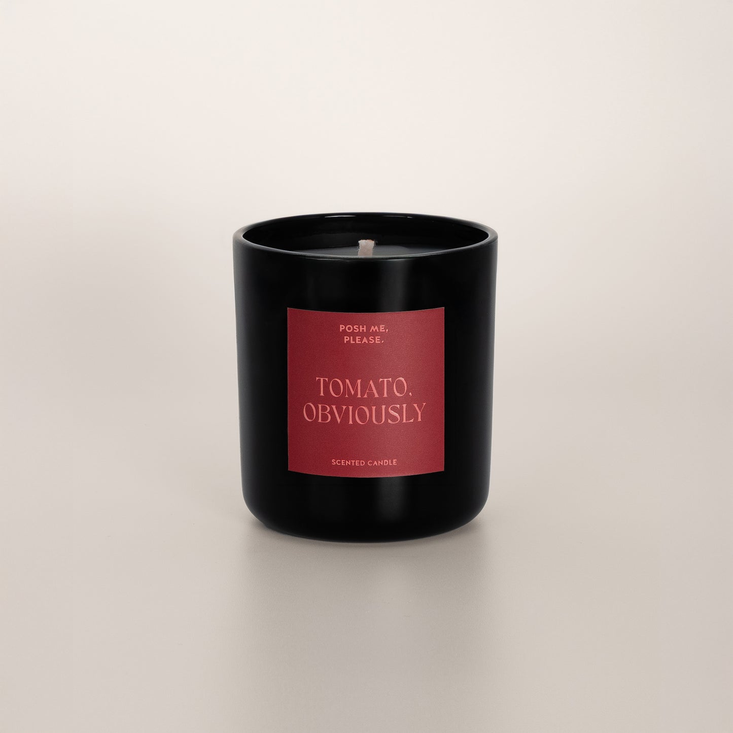 Tomato, Obviously coconut wax candle in black glass vessel, no lid, cotton wick
visible